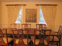 Drapes on decorative hardware for dining room windows in Westchester, New York